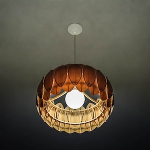 May include: A wooden pendant light fixture with a circular design and a white light bulb. The fixture is made up of many individual wooden pieces that resemble leaves.