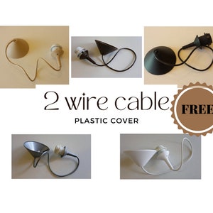 May include: Five different colours of 2-wire electrical cords with a plastic cover and a lamp socket. The colours are beige, black, grey, white, and brown. The text "2 wire cable" and "FREE" are visible in the image.