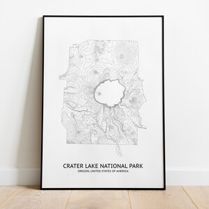 May include: A black and white topographic map print of Crater Lake National Park in Oregon, United States of America. The print is framed in a black frame.