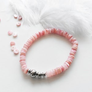 Elastic bracelet with pearly salmon pink Heishi beads and stainless steel beads