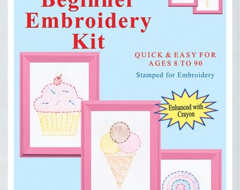 May include: Beginner embroidery kit with three patterns: a cupcake, an ice cream cone, and a lollipop. The patterns are stamped on white fabric and are ready to be embroidered. The kit includes a hoop, needle, floss, and easy-to-follow instructions. The kit is designed to fit a 5" x 7" frame.