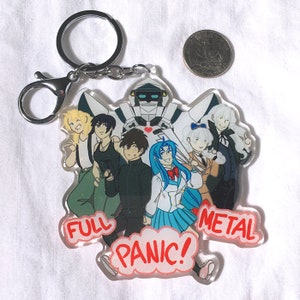 May include: A keychain featuring a group of anime characters from the show "Full Metal Panic!" The characters are standing in front of a white robot with a red heart on its chest. The keychain is made of clear acrylic with a glittery finish. The text "Full Metal Panic!" is written in pink on the keychain.