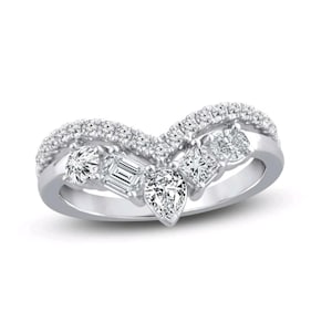 May include: A silver ring with a curved design, featuring multiple clear gemstones. The ring has a row of small stones along the top curve and larger stones in various shapes, including round, emerald cut, and pear-shaped, set along the bottom curve.