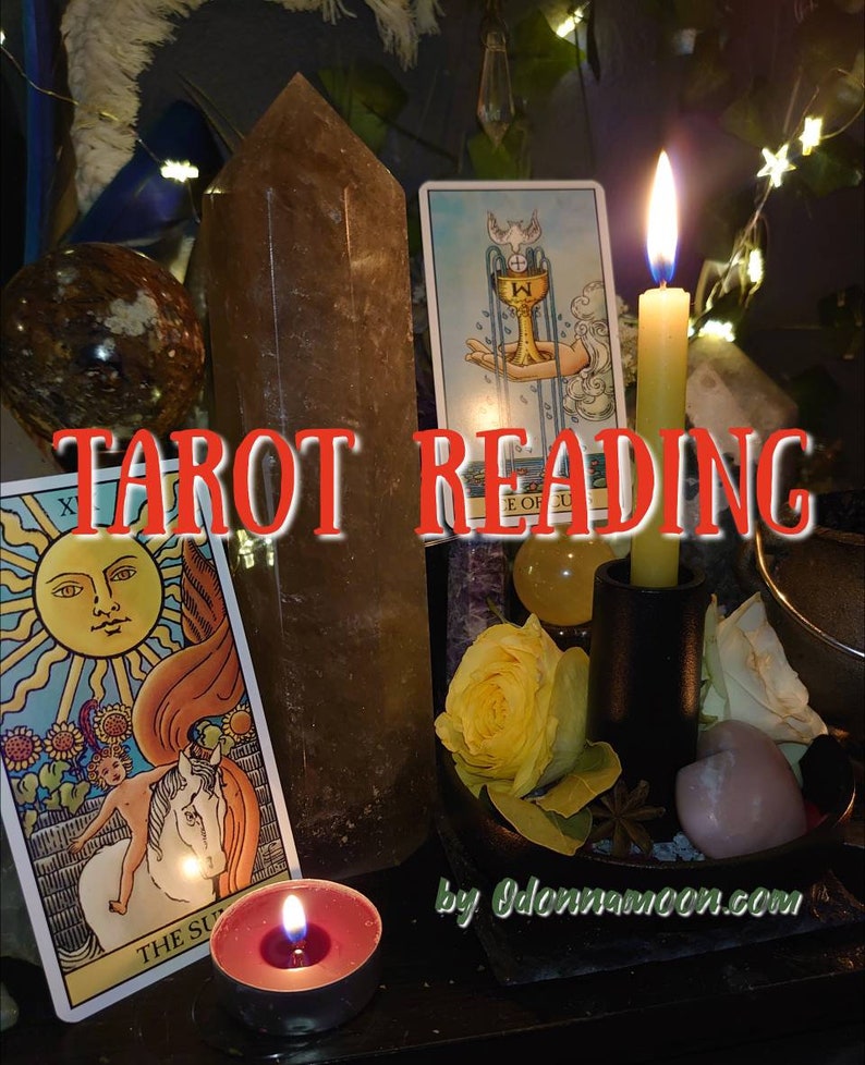 May include: A still life arrangement featuring tarot cards, crystals, and candles. The text "TAROT READING" is displayed prominently. A lit candle and a yellow rose add warmth to the scene. The website address is also visible.