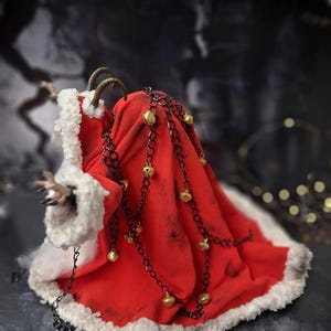 Handmade Krampus art doll from full left side angle – spooky gothic Christmas collectible showing detailed sculpting, textures, and dark holiday decor.