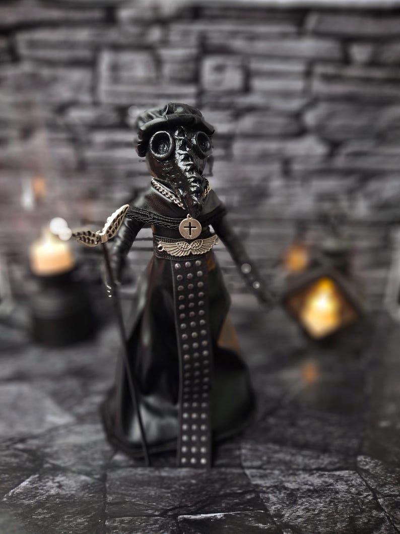 Handmade gothic plague doctor art doll viewed from a slightly right-tilted upper diagonal angle, showing intricate handcrafted details and dark vintage gothic design for collectible display.