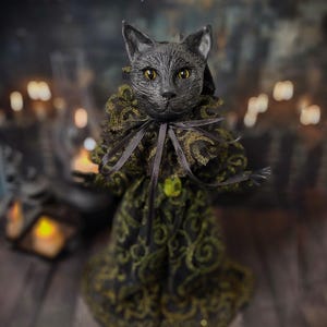 Front wide view of a handmade black cat doll standing, showcasing whimsical gothic design, detailed sculpting, and hand-painted features, a unique collectible perfect for black cat lovers, spooky home décor, Halloween displays, and gothic cat art collections.
