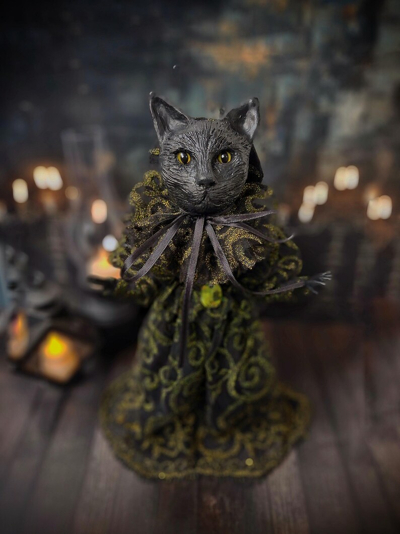 Front wide view of a handmade black cat doll standing, showcasing whimsical gothic design, detailed sculpting, and hand-painted features, a unique collectible perfect for black cat lovers, spooky home décor, Halloween displays, and gothic cat art collections.