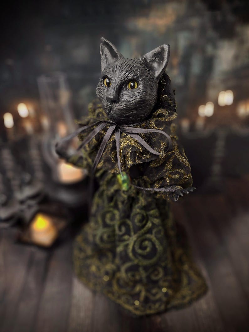 Front-left wide view of a handmade black cat doll standing and facing left, showcasing detailed sculpting, hand-painted features, and whimsical gothic design, a unique collectible perfect for black cat lovers, spooky home décor, Halloween displays, and gothic cat art collections.