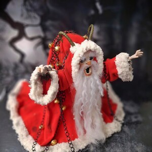 Top-down view of handmade Krampus art doll from right diagonal angle – spooky gothic Christmas collectible showing detailed sculpting, textures, and dark holiday decor.
