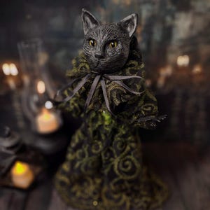 Front-left diagonal view of a handmade black cat doll standing, showing detailed sculpting, hand-painted features, and whimsical gothic design, a unique collectible perfect for black cat lovers, spooky home décor, Halloween displays, and gothic cat art collections.