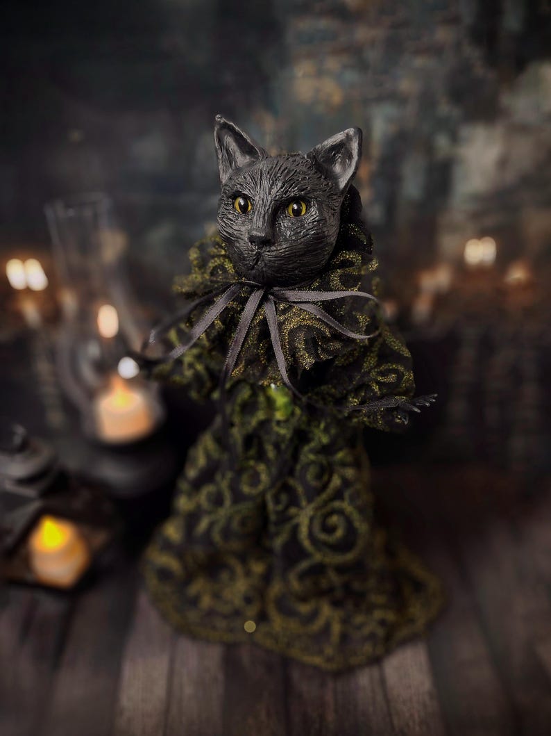 Front-left diagonal view of a handmade black cat doll standing, showing detailed sculpting, hand-painted features, and whimsical gothic design, a unique collectible perfect for black cat lovers, spooky home décor, Halloween displays, and gothic cat art collections.