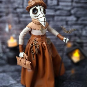 Handmade gothic plague doctor art doll shown from right side profile, highlighting handcrafted details and dark vintage gothic design.