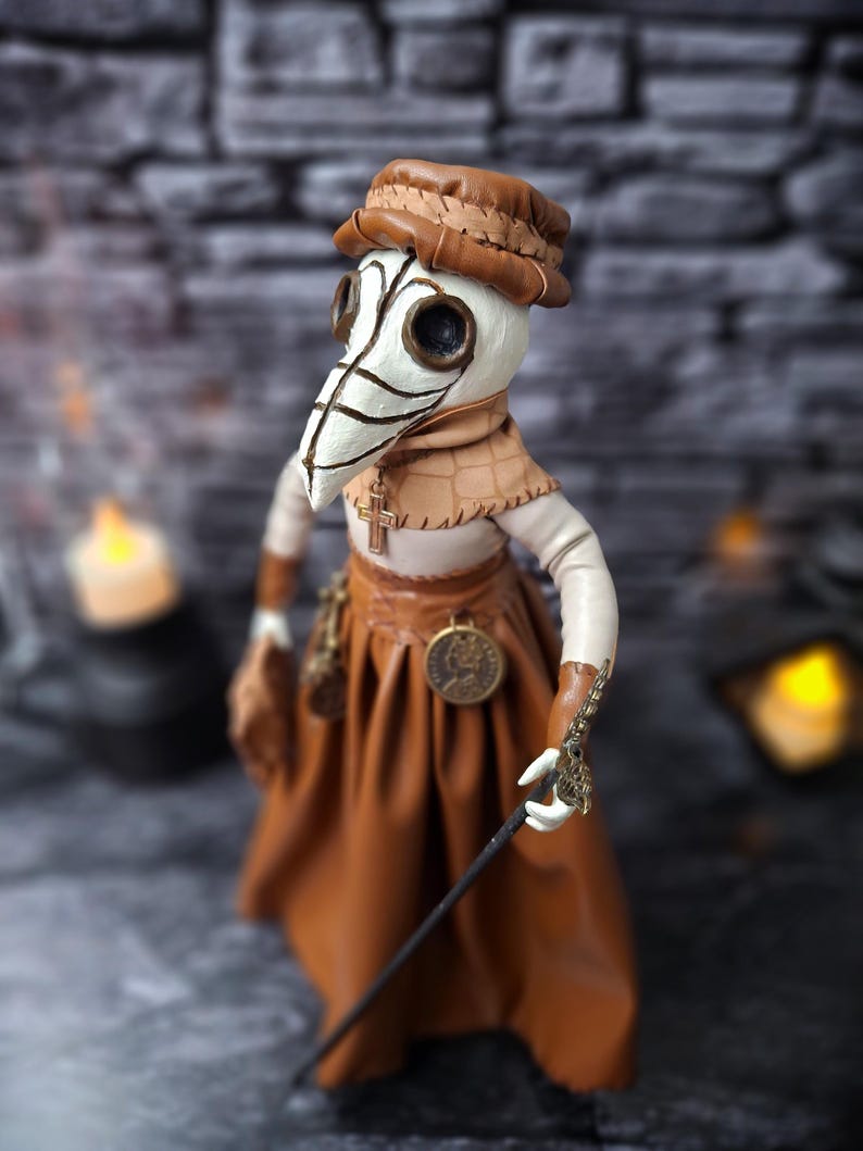 Handmade gothic plague doctor art doll viewed from upper left top angle, showing detailed handcrafted features and dark vintage gothic design.