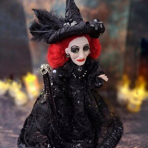 Top-down right side view of the handmade fancy witch art doll, highlighting her hand-painted face, whimsical witch outfit, and enchanting accessories.