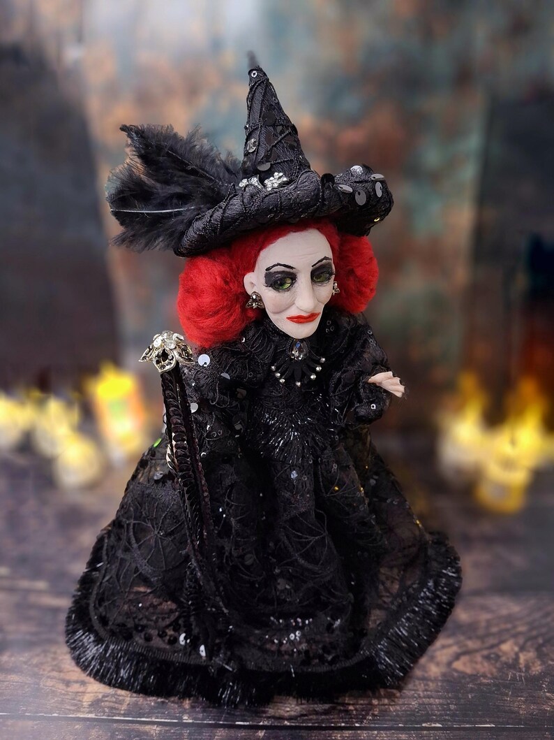 Top-down right side view of the handmade fancy witch art doll, highlighting her hand-painted face, whimsical witch outfit, and enchanting accessories.