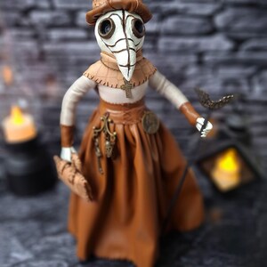 Handmade gothic plague doctor art doll viewed from right diagonal angle, highlighting handcrafted details and dark vintage gothic design.
