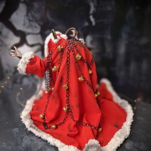 Handmade Krampus art doll viewed from straight back – spooky gothic Christmas collectible showing detailed sculpting, textures, and dark holiday decor.