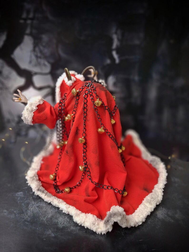 Handmade Krampus art doll viewed from straight back – spooky gothic Christmas collectible showing detailed sculpting, textures, and dark holiday decor.