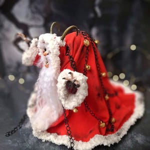 Handmade Krampus art doll from full left side angle – spooky gothic Christmas collectible showing detailed sculpting, textures, and dark holiday decor.