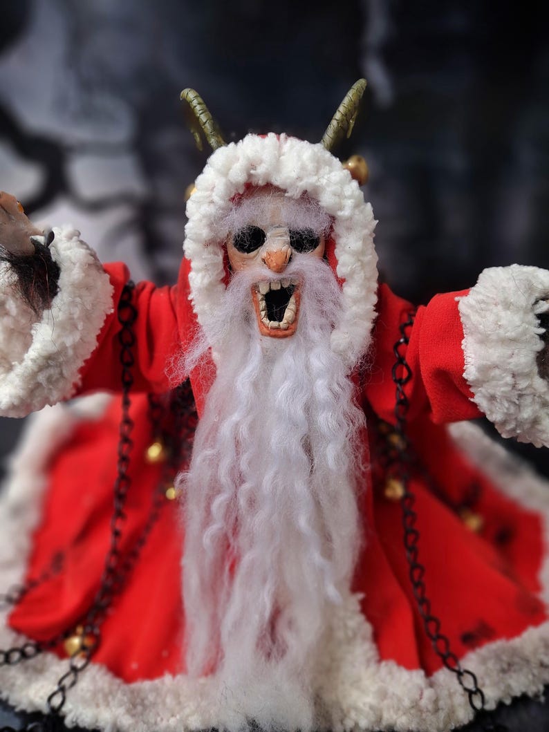 Close-up of handmade Krampus art doll standing straight – spooky gothic Christmas collectible showing detailed sculpting, textures, and dark holiday decor.