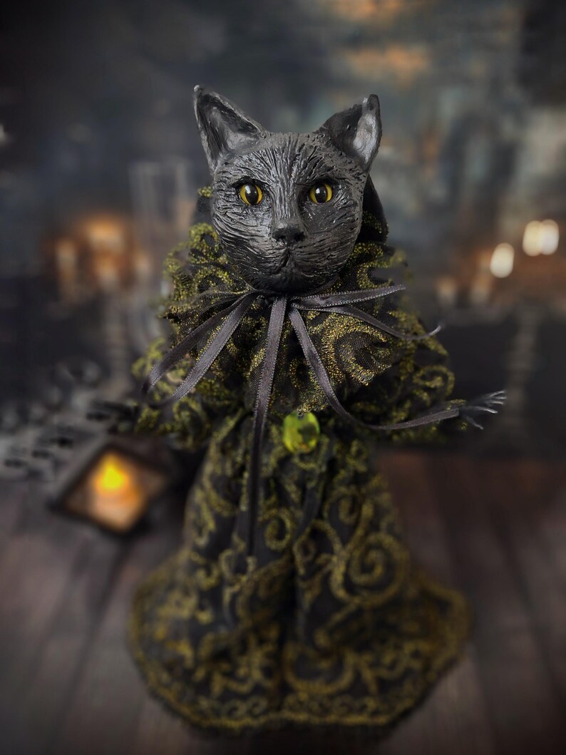 Slightly front-left angled view of a handmade black cat doll standing, featuring whimsical gothic design, hand-painted details, and sculpted features, a unique collectible perfect for black cat lovers, spooky home décor, Halloween displays, and gothic cat art collections.
