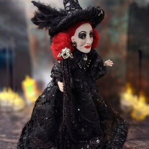Right side view of the handmade fancy witch art doll, highlighting her hand-painted face, whimsical witch outfit, and enchanting accessories.