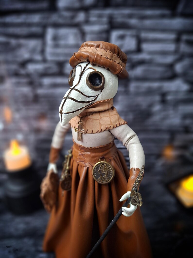 Handmade gothic plague doctor art doll shown from left side profile, highlighting handcrafted details and dark vintage gothic design.