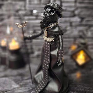 Handmade gothic plague doctor art doll viewed from lower right angle, highlighting detailed handcrafted features and dark vintage design for gothic collectible display.