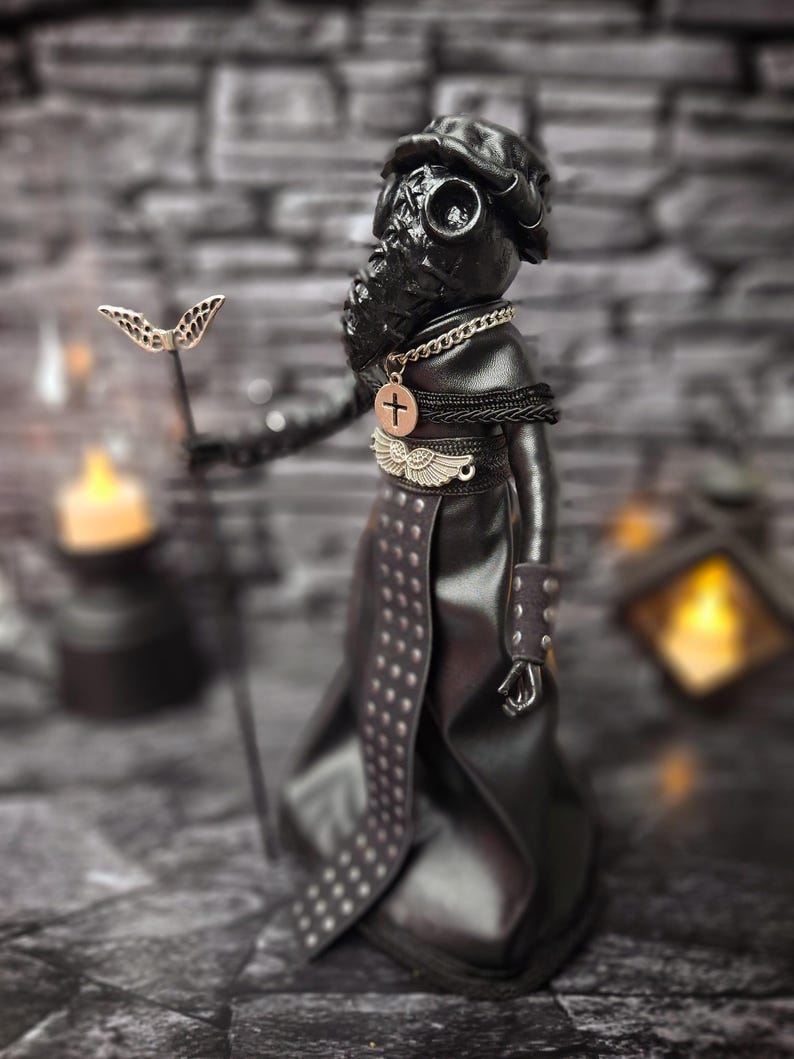 Handmade gothic plague doctor art doll in close-up left view, displaying detailed handcrafted features and dark vintage design for gothic collectible display.