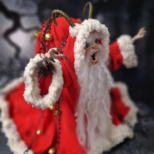 Handmade Krampus art doll viewed from top right diagonal angle – spooky gothic Christmas collectible showing detailed sculpting, textures, and dark holiday decor.