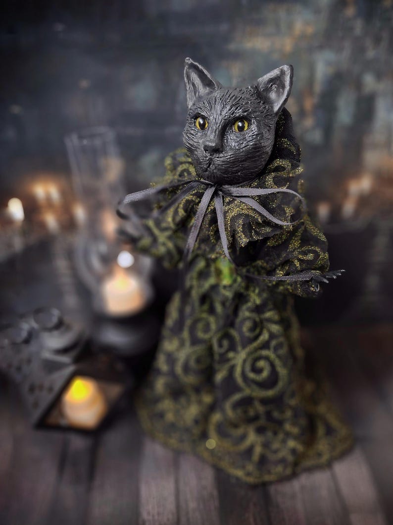 Front-left diagonal wide view of a handmade black cat doll standing, featuring whimsical gothic design, detailed sculpting, and hand-painted details, perfect for spooky home décor, Halloween displays, gothic black cat collections, and as a unique cat collectible or gift.