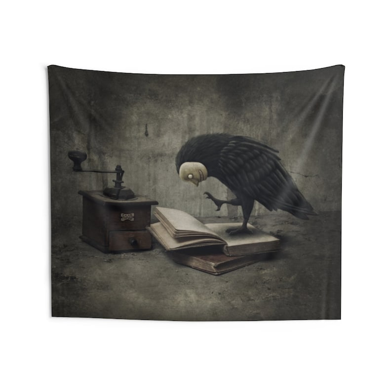 May include: A black crow with a white face is perched on an open book. The crow is looking at the book with a curious expression. There is a wooden coffee grinder in the background.
