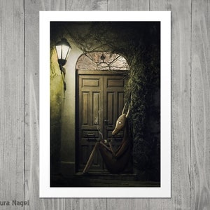 May include: A dark, moody illustration of a creature with a deer-like head sitting outside a wooden door. The creature is wearing a brown, textured outfit and has a cigarette in its mouth. The door is surrounded by overgrown vines and a street lamp casts a warm glow on the scene.