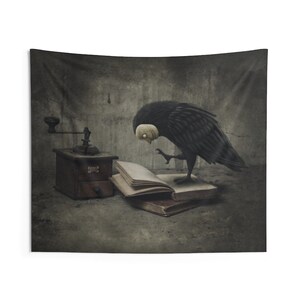 May include: A black bird with a white face is perched on a stack of books. The bird is looking at a vintage coffee grinder on a table in a dark room.