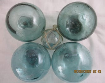Set of Four, 4" inch hand blown Antique Japanese glass floats plus a tiny float