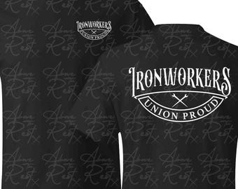 May include: Black t-shirt with a white graphic print that says "Ironworkers Union Proud" with crossed wrenches in the center of the logo. The shirt has a repeating pattern of the words "Above the Rest" in a handwritten font.