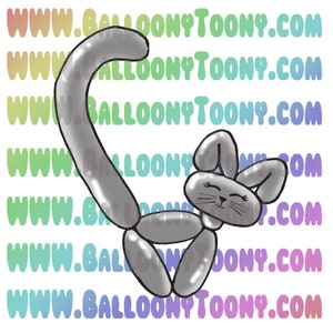 May include: A silver balloon animal shaped like a cat with a long tail and big ears. The cat is smiling and has a cute expression.