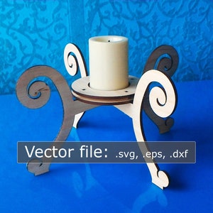 May include: A wooden candle holder with a swirling design. The holder has four legs and a circular top with a hole in the center for a candle. A white candle is sitting in the holder.