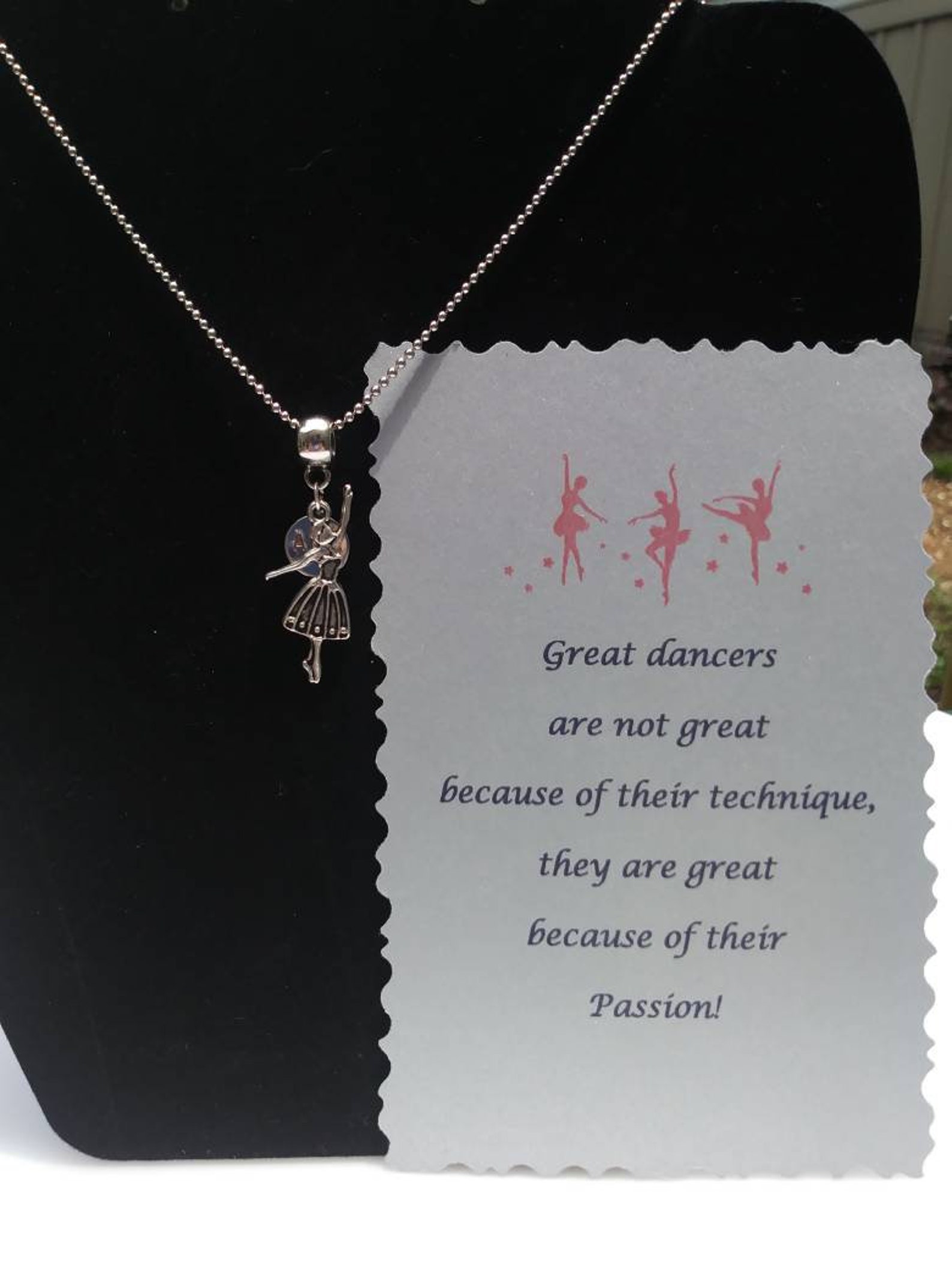 ballet shoes or ballet dancer hung on barrel bead charm holder and hung from silver plated/nickel free ballchain or black cordag
