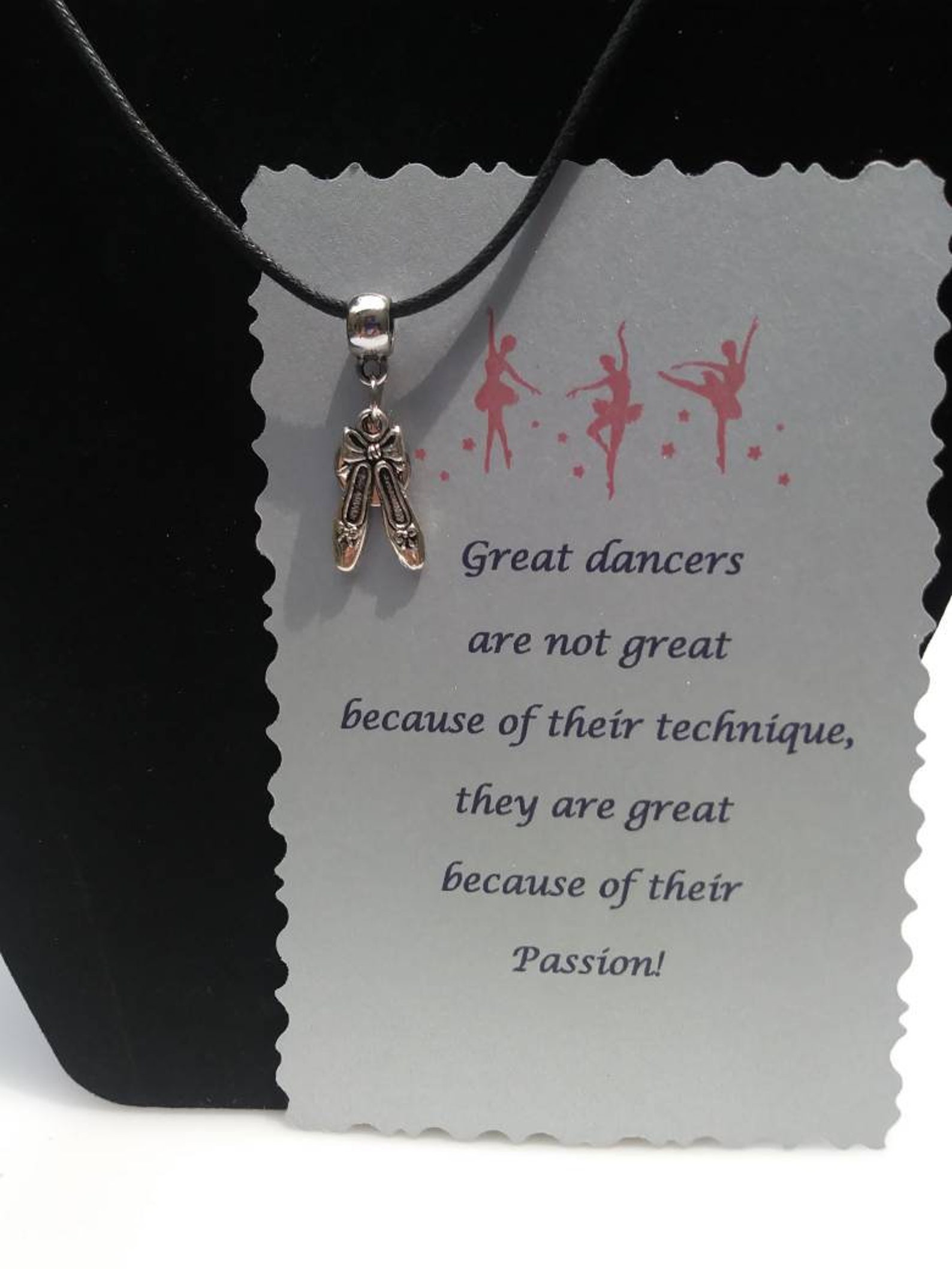 ballet shoes or ballet dancer hung on barrel bead charm holder and hung from silver plated/nickel free ballchain or black cordag