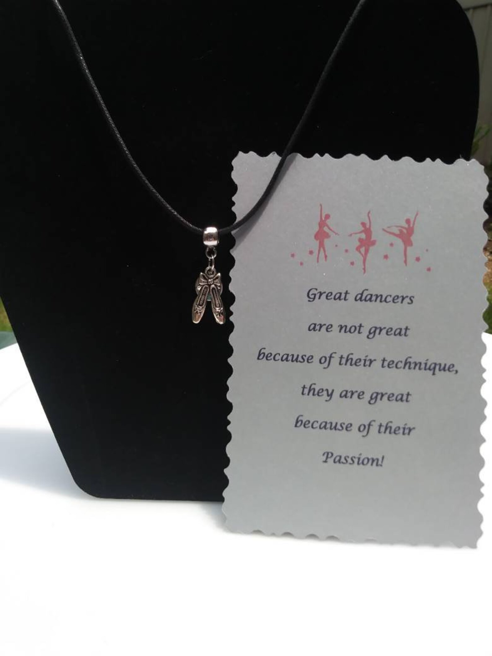 ballet shoes or ballet dancer hung on barrel bead charm holder and hung from silver plated/nickel free ballchain or black cordag
