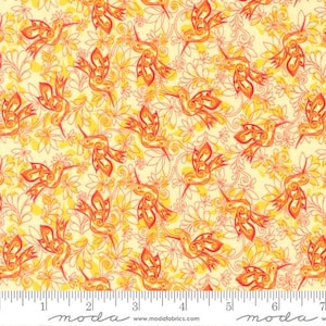 May include: A yellow fabric with a repeating pattern of orange hummingbirds and stylized flowers. The fabric has a ruler with the word "moda" printed on it.