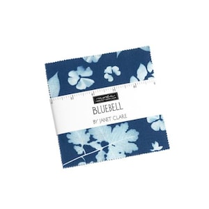 May include: A blue fabric square with a white floral print. The fabric is labeled "Bluebell by Janet Clare".