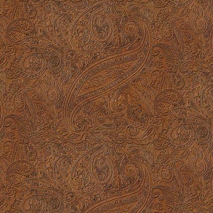 May include: A seamless pattern featuring a detailed paisley design. The pattern is embossed on a brown surface, creating a textured effect. The design includes curved, teardrop-shaped motifs and floral elements.