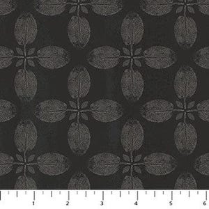 May include: Black fabric with a repeating pattern of stylized, gray leaf shapes. The leaves are arranged in a symmetrical, four-leaf clover design. The fabric has a subtle texture and a dark background, with a ruler at the bottom.