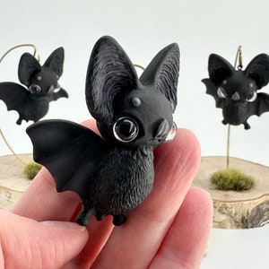 Sugarleaf Bats, in black, brown and lavender