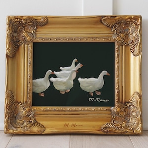May include: A framed painting depicting five white geese against a dark green backdrop. The artwork is signed "M. Marcia" in the lower right corner.