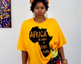 Unisex "Africa is not a Test Lab" T-shirt with African Map art (yellow patch Ankara multi-pattern dashiki)