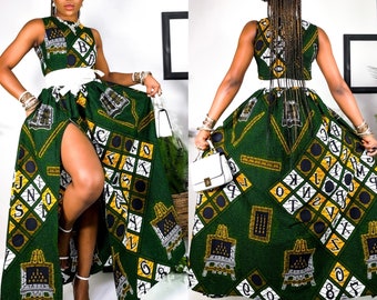 May include: A green and yellow maxi skirt with a high slit and a matching crop top. The skirt and top feature a pattern of letters, numbers, and images of easels.